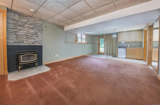 44 Richard Ave, Wolcott, CT 06716 - unfurnished living room featuring a wood stove and carpet floors