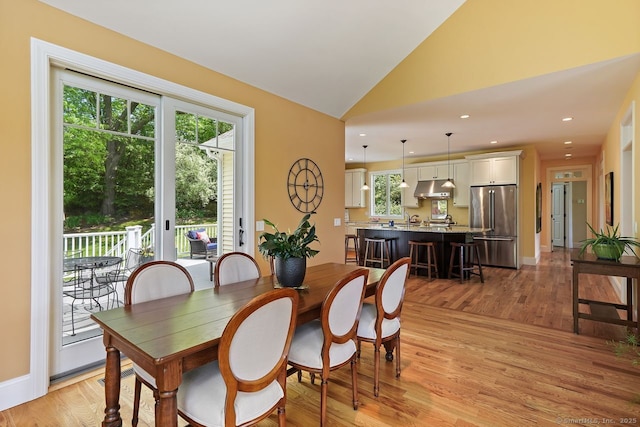 8 Meadowview Dr, Brookfield, CT 06804 - dining room featuring light wood-style flooring, vaulted ceiling, and recessed lighting