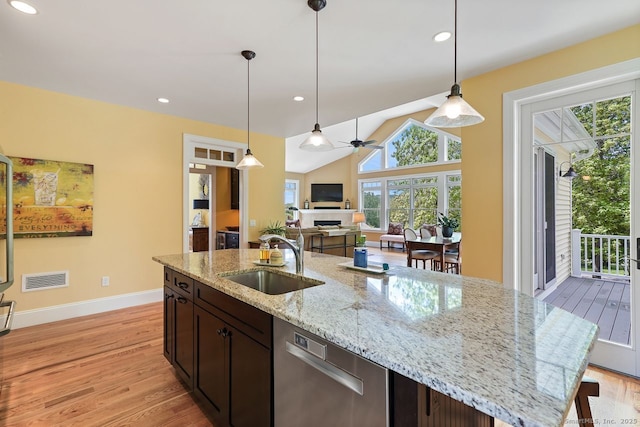 8 Meadowview Dr, Brookfield, CT 06804 - kitchen with stainless steel dishwasher, light wood finished floors, dark brown cabinets, pendant lighting, and recessed lighting