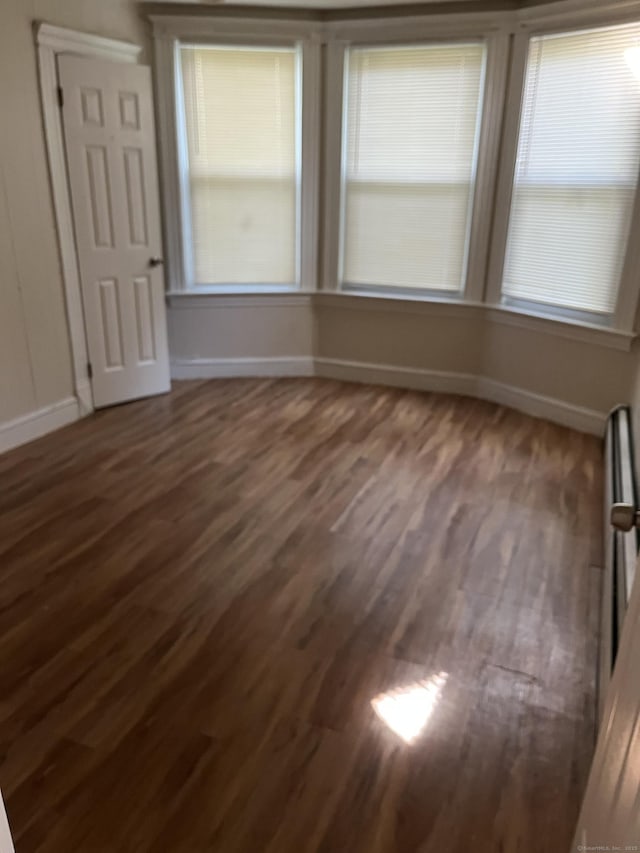 54 Morningside Ave, Waterbury, CT 06708 - empty room with dark wood-style floors and baseboards