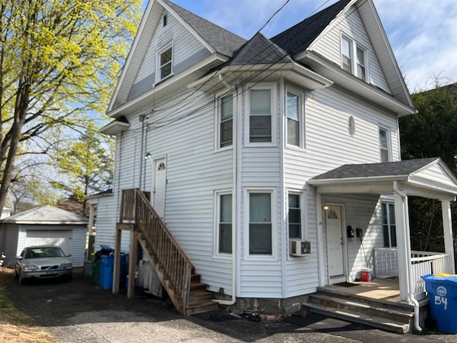 54 Morningside Ave, Waterbury, CT 06708 - view of front of home featuring driveway, an outdoor structure, a detached garage, a porch, and a shingled roof