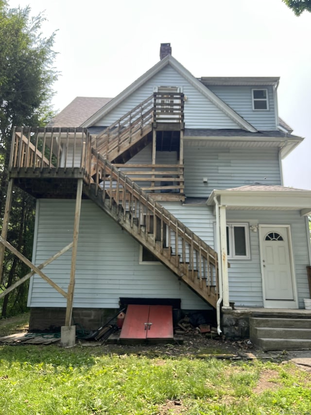 54 Morningside Ave, Waterbury, CT 06708 - rear view of house featuring stairway, a wooden deck, and a chimney