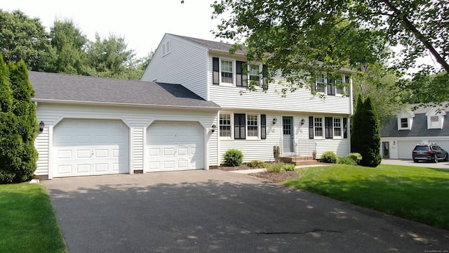 55 Addison Pond Rd Unit 55, Glastonbury, CT 06033 - colonial house with a garage, driveway, a front lawn, and roof with shingles