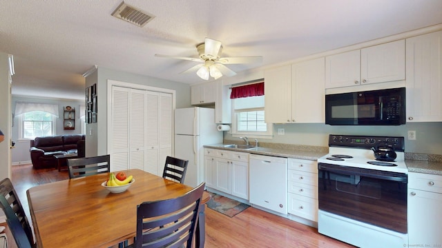 55 Addison Pond Rd Unit 55, Glastonbury, CT 06033 - kitchen featuring white appliances, a ceiling fan, white cabinetry, and plenty of natural light