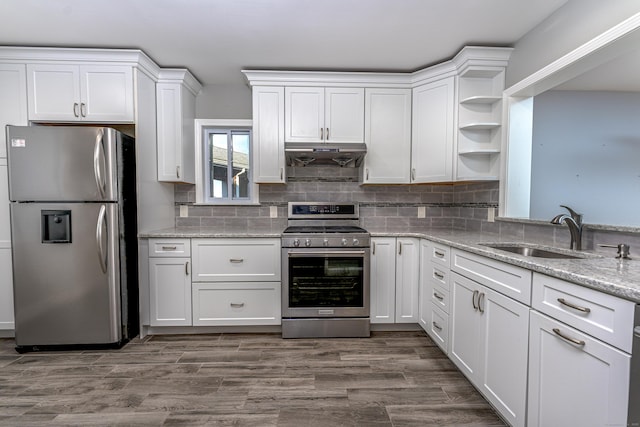 2 Mansfield Grove Rd Apt 374, East Haven, CT 06512 - kitchen featuring appliances with stainless steel finishes, a sink, under cabinet range hood, open shelves, and white cabinetry