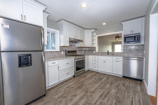 2 Mansfield Grove Rd Apt 374, East Haven, CT 06512 - kitchen featuring appliances with stainless steel finishes, under cabinet range hood, white cabinets, light wood-style floors, and recessed lighting