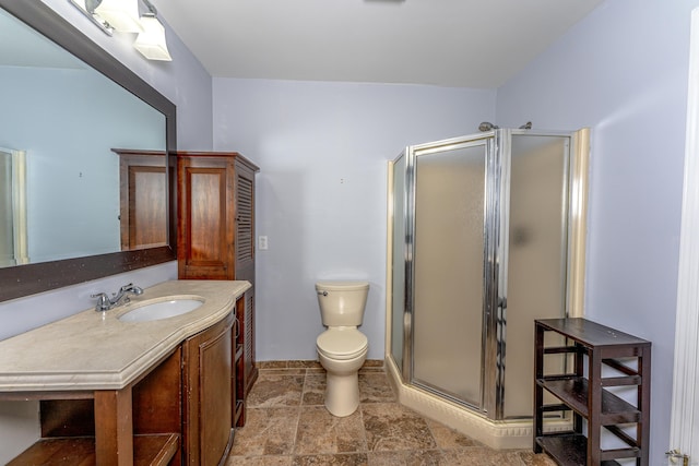 2 Mansfield Grove Rd Apt 374, East Haven, CT 06512 - bathroom featuring vanity, a stall shower, toilet, and stone finish floors