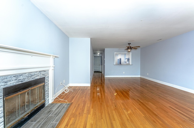 2 Mansfield Grove Rd Apt 374, East Haven, CT 06512 - unfurnished living room with a stone fireplace, wood finished floors, ceiling fan, and baseboards