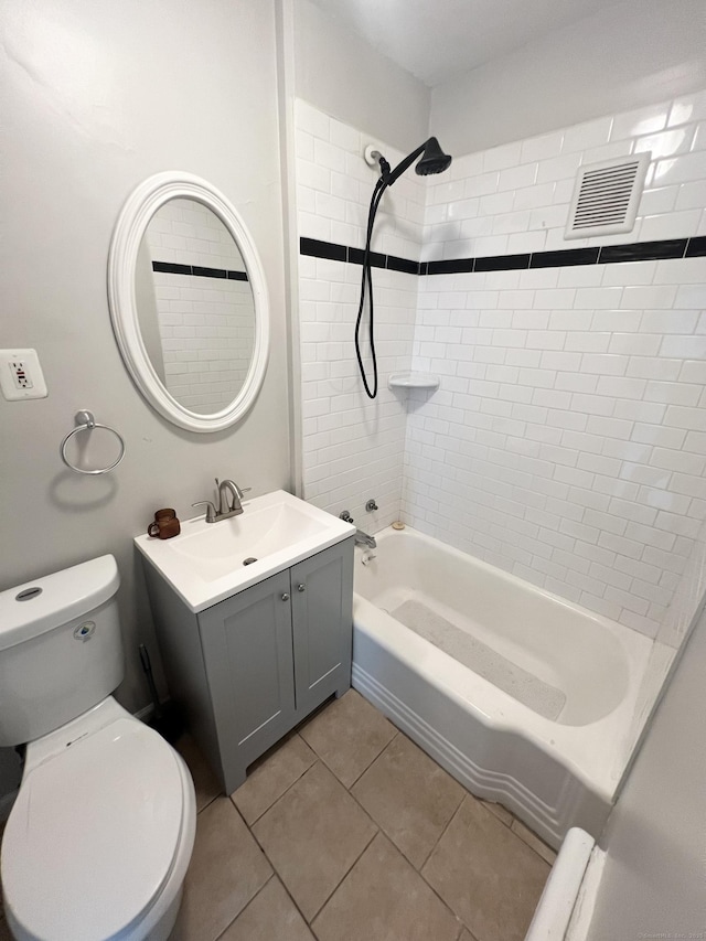 127 Smalley St, New Britain, CT 06051 - bathroom featuring vanity, shower / bathtub combination, toilet, and tile patterned floors