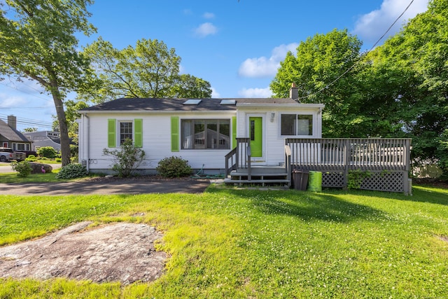 134 Mansfield Grove Rd, East Haven, CT 06512 - view of front of house featuring a chimney, a front lawn, and a deck