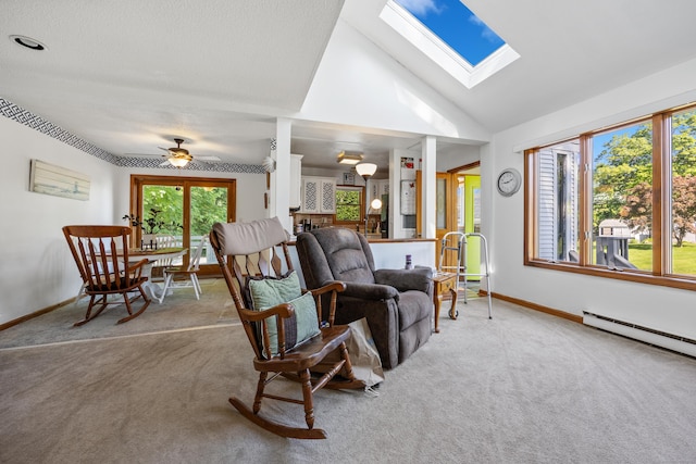 134 Mansfield Grove Rd, East Haven, CT 06512 - carpeted living room with baseboards, a skylight, lofted ceiling, a baseboard heating unit, and ceiling fan