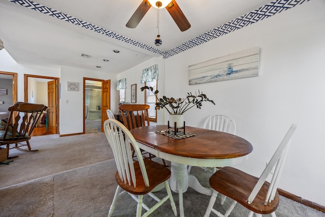 134 Mansfield Grove Rd, East Haven, CT 06512 - dining room featuring light carpet, ceiling fan, and baseboards
