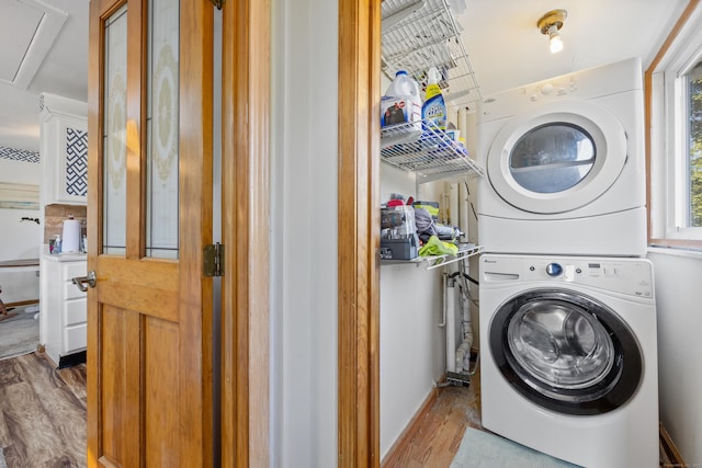 134 Mansfield Grove Rd, East Haven, CT 06512 - washroom featuring stacked washer / dryer, wood finished floors, and attic access