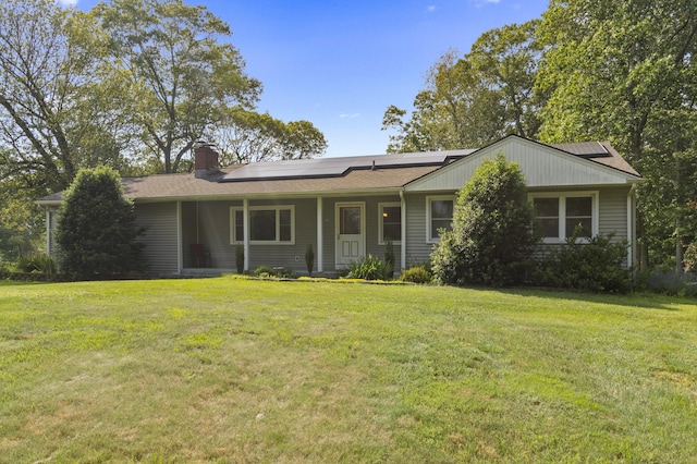 64 Obed Hts, Old Saybrook, CT 06475 - ranch-style home featuring a chimney, roof mounted solar panels, a front lawn, and covered porch