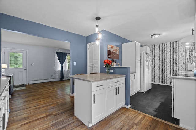 64 Obed Hts, Old Saybrook, CT 06475 - kitchen featuring a baseboard heating unit, white cabinetry, healthy amount of natural light, dark wood-type flooring, and wallpapered walls