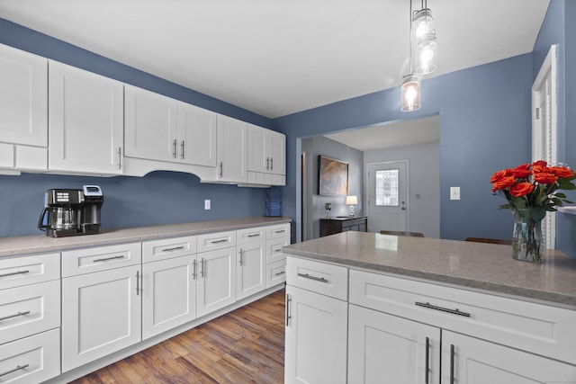 64 Obed Hts, Old Saybrook, CT 06475 - kitchen featuring white cabinetry, light wood-type flooring, hanging light fixtures, and light stone countertops