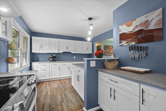 64 Obed Hts, Old Saybrook, CT 06475 - kitchen with stainless steel electric range oven, light wood-type flooring, white cabinetry, and pendant lighting