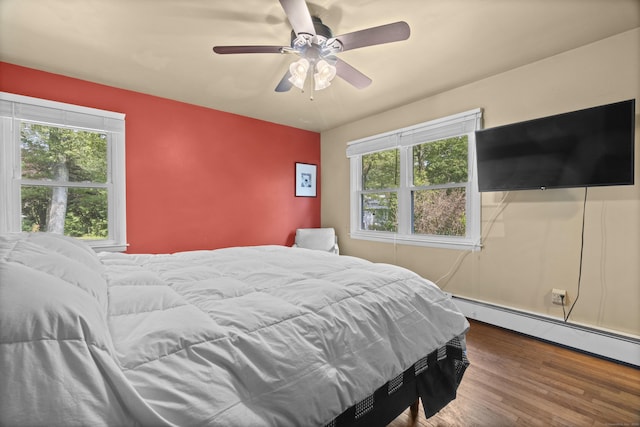 64 Obed Hts, Old Saybrook, CT 06475 - bedroom featuring multiple windows, wood finished floors, ceiling fan, and a baseboard radiator