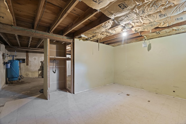 64 Obed Hts, Old Saybrook, CT 06475 - unfinished basement featuring a water pressure tank and tile patterned floors