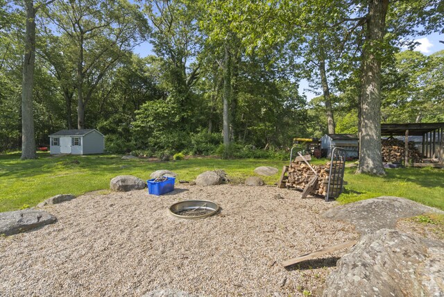 64 Obed Hts, Old Saybrook, CT 06475 - view of grassy yard with an outdoor structure