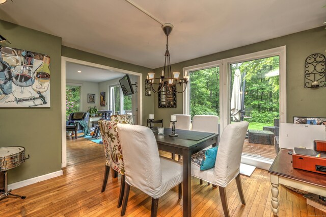 225 Rocky Mountain Rd, Southbury, CT 06488 - dining room featuring a chandelier, light wood-style floors, and baseboards