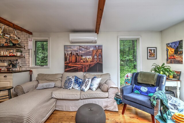 225 Rocky Mountain Rd, Southbury, CT 06488 - living room featuring a wall mounted air conditioner, hardwood / wood-style floors, and beam ceiling
