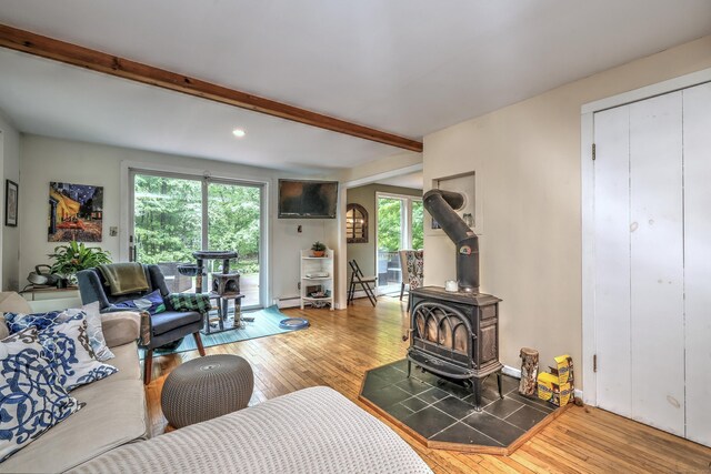 225 Rocky Mountain Rd, Southbury, CT 06488 - living room with a wood stove, wood-type flooring, beamed ceiling, healthy amount of natural light, and recessed lighting