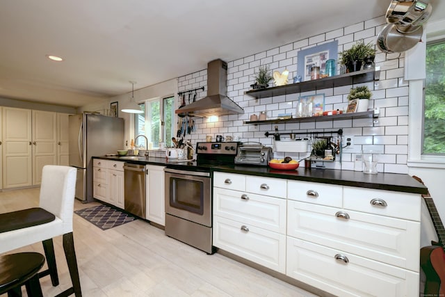 225 Rocky Mountain Rd, Southbury, CT 06488 - kitchen featuring stainless steel appliances, wall chimney exhaust hood, a sink, dark countertops, and backsplash