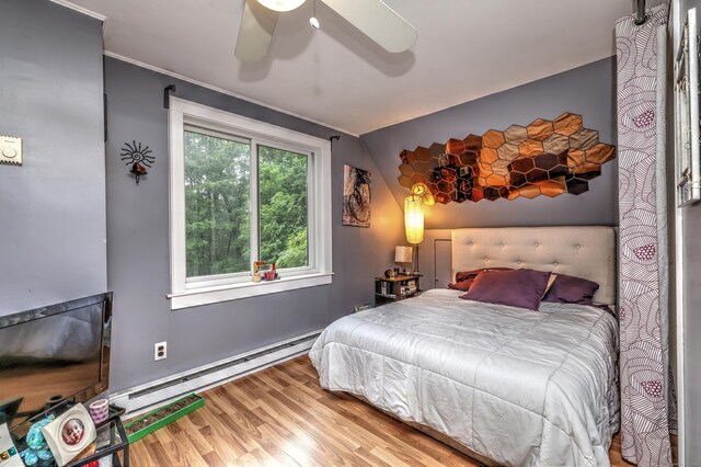 225 Rocky Mountain Rd, Southbury, CT 06488 - bedroom with a baseboard radiator, wood finished floors, a ceiling fan, and vaulted ceiling