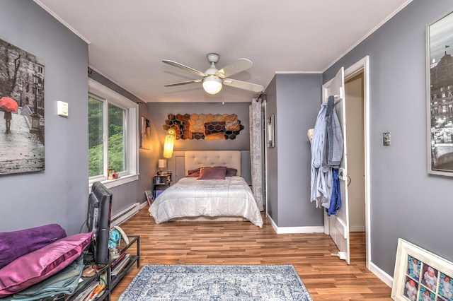 225 Rocky Mountain Rd, Southbury, CT 06488 - bedroom featuring wood finished floors, baseboards, ornamental molding, baseboard heating, and ceiling fan