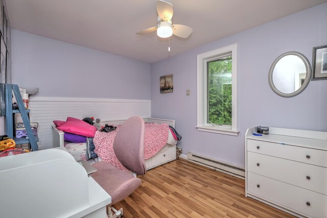 225 Rocky Mountain Rd, Southbury, CT 06488 - bedroom with a baseboard radiator, light wood-type flooring, and a ceiling fan