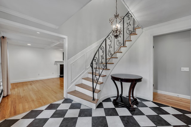 206 Ludlow Rd, Manchester, CT 06040 - stairs with a fireplace, a chandelier, and crown molding