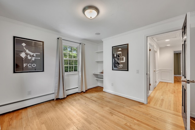 206 Ludlow Rd, Manchester, CT 06040 - spare room featuring light wood finished floors, baseboard heating, and crown molding