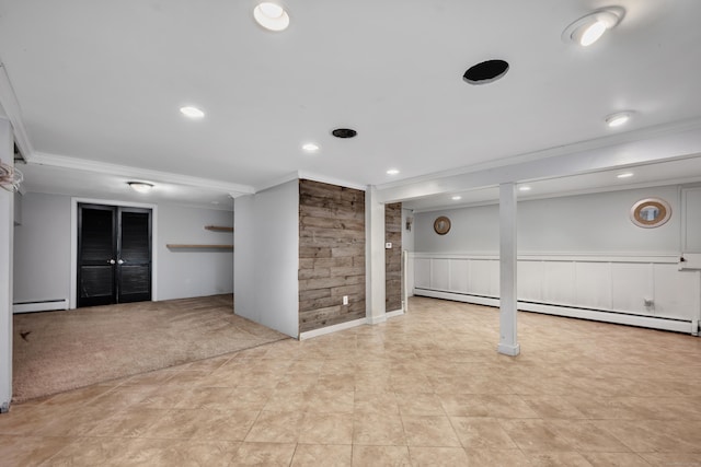 206 Ludlow Rd, Manchester, CT 06040 - finished below grade area with crown molding, a baseboard heating unit, baseboard heating, recessed lighting, and a wainscoted wall