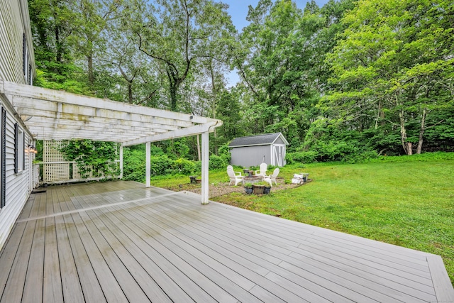 206 Ludlow Rd, Manchester, CT 06040 - deck featuring a pergola, a storage shed, a lawn, and a fire pit