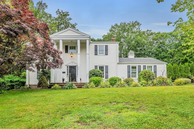 206 Ludlow Rd, Manchester, CT 06040 - greek revival house featuring a chimney and a front yard