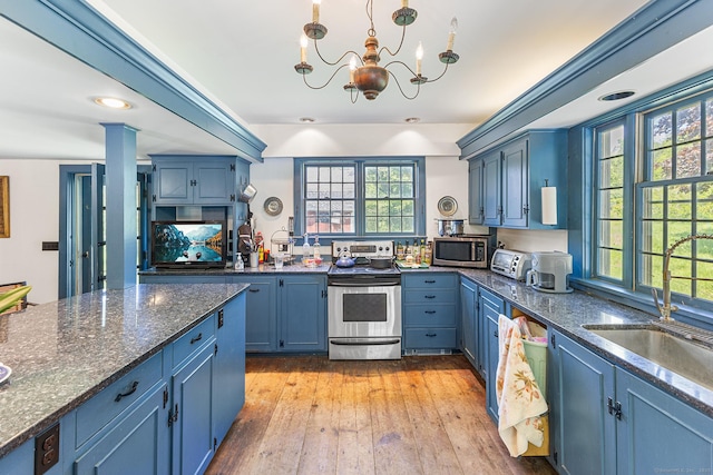 27 Tobey Hill Rd, North Canaan, CT 06018 - kitchen featuring appliances with stainless steel finishes, blue cabinets, a chandelier, and dark stone counters