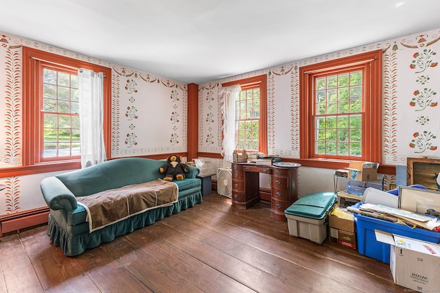 27 Tobey Hill Rd, North Canaan, CT 06018 - living area featuring wallpapered walls, wood-type flooring, and a baseboard heating unit