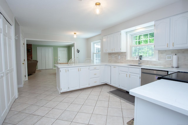 12 Northwoods Rd, Granby, CT 06060 - kitchen with a sink, stainless steel dishwasher, a peninsula, and decorative backsplash