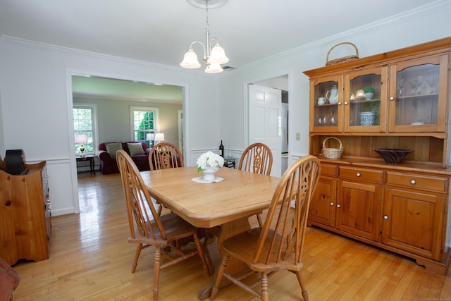 12 Northwoods Rd, Granby, CT 06060 - dining room with light wood-style flooring, crown molding, and a chandelier