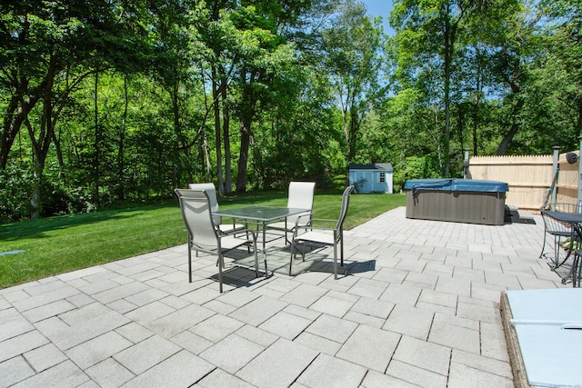 12 Northwoods Rd, Granby, CT 06060 - view of patio with a hot tub, outdoor dining space, and a storage shed