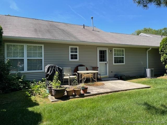 150 Forest Rd Unit 40, Milford, CT 06461 - rear view of house with a patio area and a yard