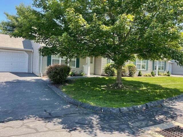 150 Forest Rd Unit 40, Milford, CT 06461 - obstructed view of property featuring a front yard and asphalt driveway