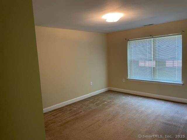 150 Forest Rd Unit 40, Milford, CT 06461 - unfurnished room with baseboards and carpet