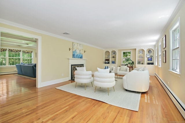 151 Woodridge Dr, New Canaan, CT 06840 - living room with a baseboard heating unit, light wood-type flooring, a fireplace, built in features, and plenty of natural light