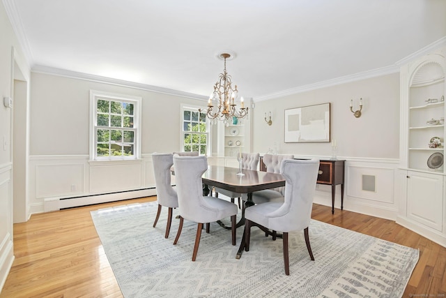 151 Woodridge Dr, New Canaan, CT 06840 - dining room with a baseboard heating unit, a chandelier, ornamental molding, light wood-style floors, and wainscoting