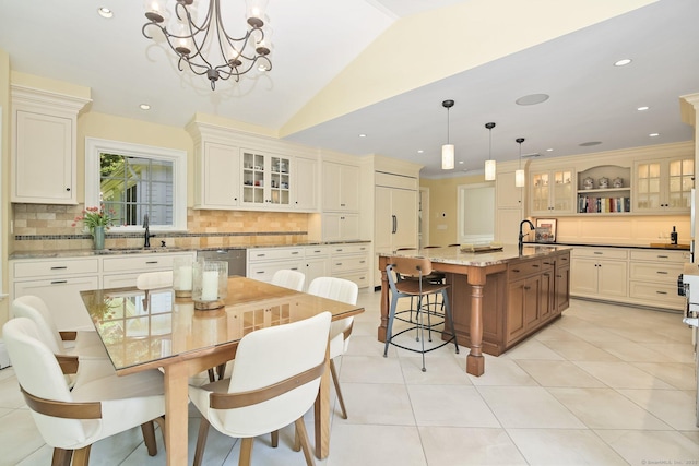 151 Woodridge Dr, New Canaan, CT 06840 - dining space with a chandelier, light tile patterned floors, vaulted ceiling, and recessed lighting
