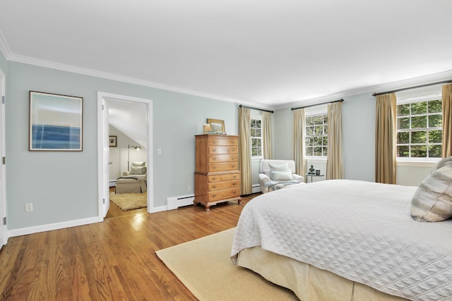 151 Woodridge Dr, New Canaan, CT 06840 - bedroom with a baseboard heating unit, crown molding, wood finished floors, and baseboards