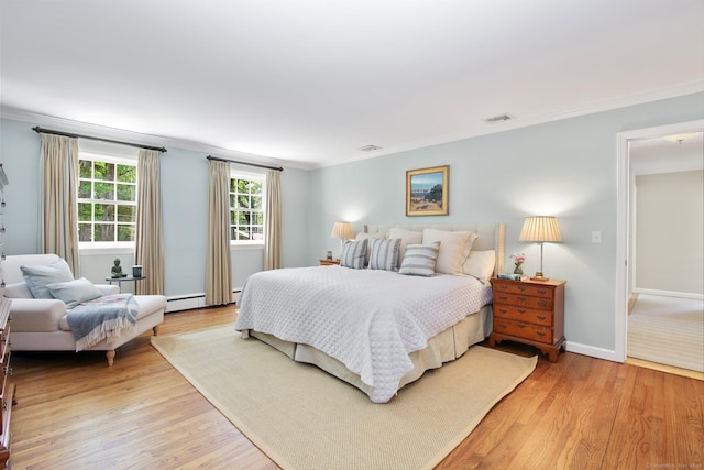 151 Woodridge Dr, New Canaan, CT 06840 - bedroom featuring crown molding, light wood-style flooring, baseboards, and a baseboard radiator