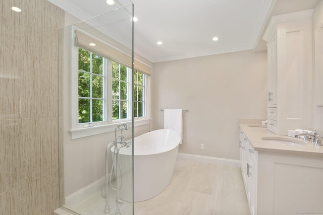 151 Woodridge Dr, New Canaan, CT 06840 - full bath with double vanity, crown molding, a freestanding bath, baseboards, and recessed lighting